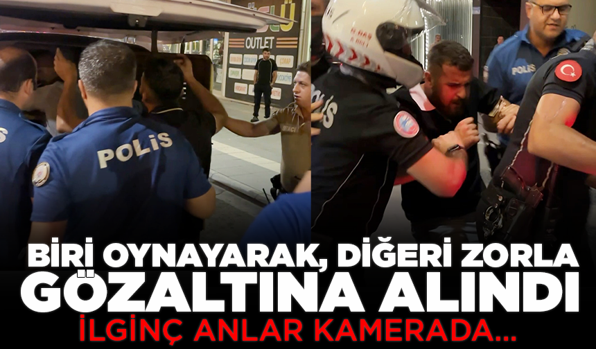 Biri oynayarak, diğeri zorla gözaltına alındı: İlginç anlar kamerada